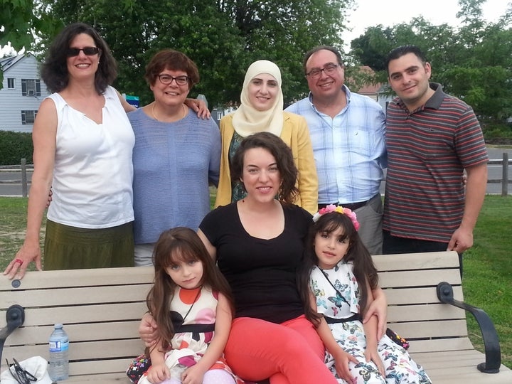 A Syrian refugee family with some of the group of 38 Canadians from Ottawa who sponsored them and are supporting them for the