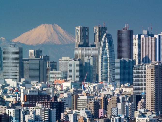 A look at the skyline in Tokyo's Shinjuku district, which is located in the central part of the city and near the Tokyo Bay. In the background is Mount Fuji, an active volcano about 60 miles southwest of Tokyo.