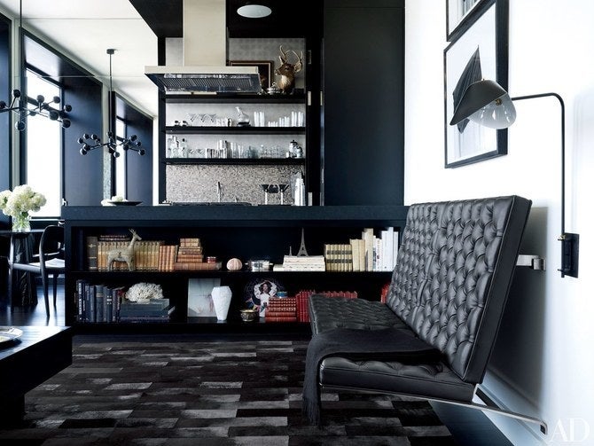 <p>A black living room by MR Architecture + Decor.</p>