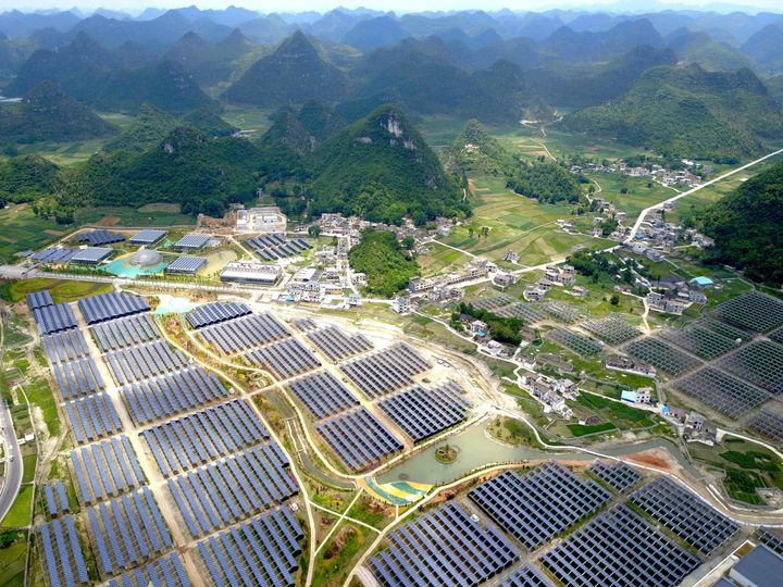 Greenhouses built with solar panels on their roofs, in Yang Fang village in Anlong, in China's southwest Guizhou province. June 10.