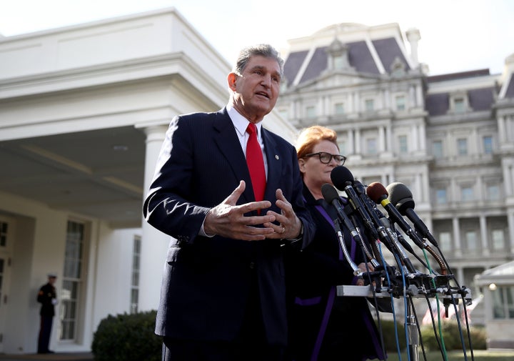 Sen. Joe Manchin (D-W.V.) and Sen. Heidi Heitkamp (D-N.D.) speak to members of the press following a meeting with President Donald Trump on Feb. 9, 2017.