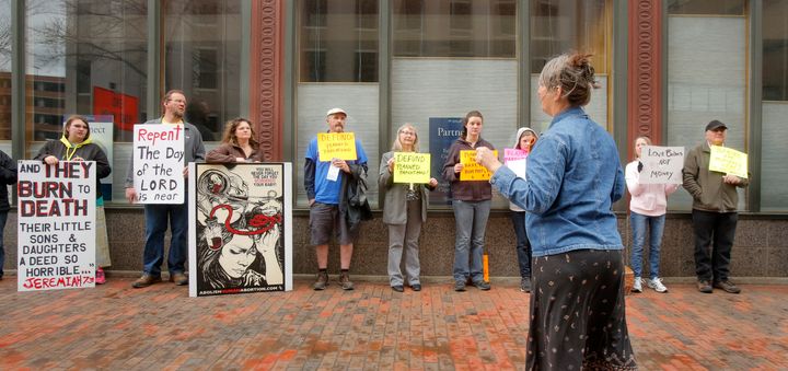 Anti-abortion protestors stand outside a Portland, Maine, abortion clinic in April.