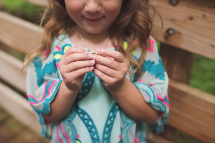Adrianna showing off her necklace.