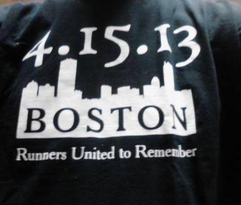 Photo of a running shirt from a tribute race to the Boston Marathon held one month later, attended by police officers who killed and captured the suspects.