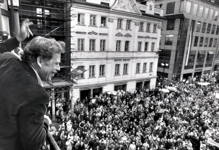  Presidential candidate Vaclav Havel waving to his supporters from a balcony in Prague on December 19 1989.