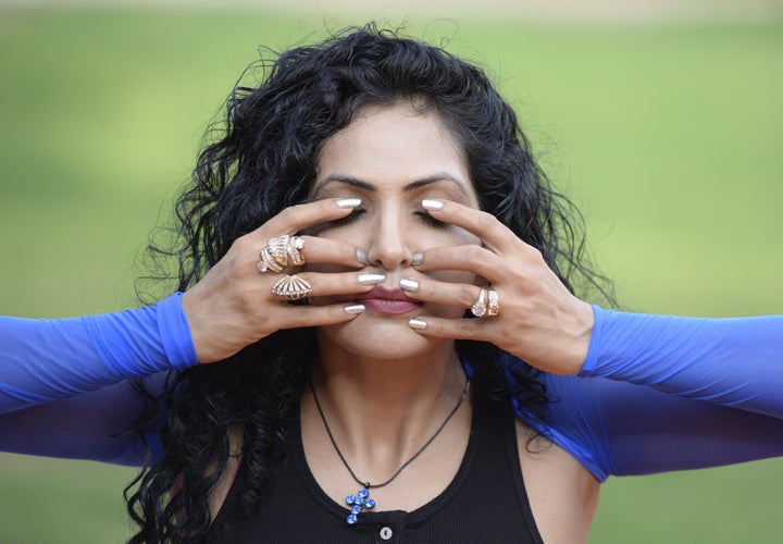 Indian celebrity yoga instructor Simran Ahuja poses for a photograph during an event to mark International Yoga Day in Hyderabad.