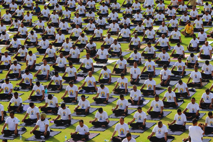 Yoga enthusiasts take part in a yoga session during the 3rd International Yoga Day at SMS stadium in Jaipur, Rajasthan, India