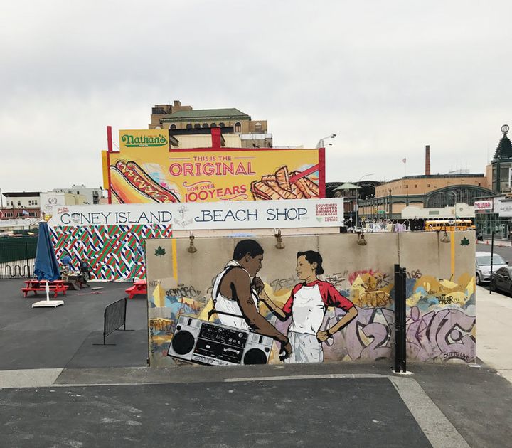 Chris Stain’s mural for Coney Art Walls 2017 integrates a photo taken by Martha Cooper on a New York street in the 1980s with an ocean swell of graffiti washing up around the young lovers. (photo © Jaime Rojo)