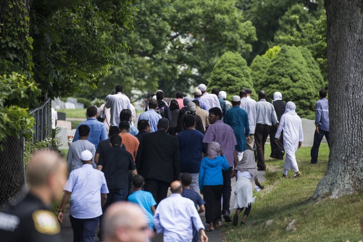 Mourners walk into Sterling Cemetery where Nabra Hassanen, who was killed Sunday, will be laid to rest in Sterling, Virginia, on June 21.