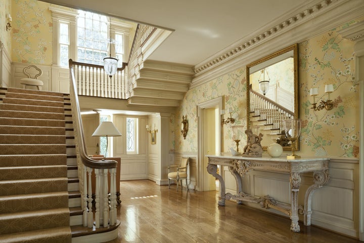 The grand entry hall opens to airy rooms for entertaining and parties.