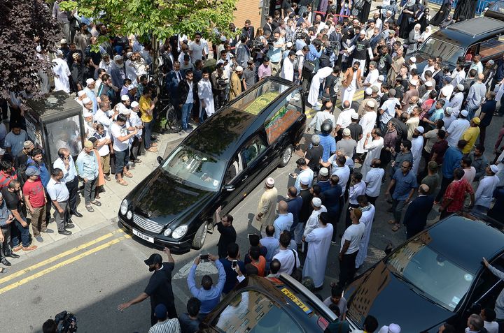The coffin of Mohammad Alhajali, a victim of the deadly Grenfell Tower blaze, is taken from the east London Mosque in Whitechapel, for his burial.