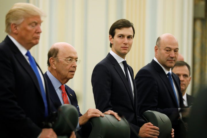 White House senior advisor Jared Kushner, center, with President Donald Trump and Commerce Secretary Wilbur Ross to his left
