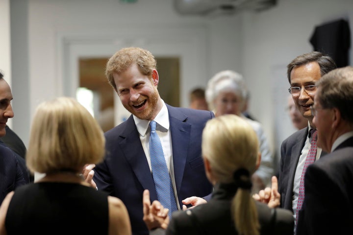 Prince Harry speaks to people during his visit to Chatham House, the Royal Institute of International Affairs on June 15 in London, England