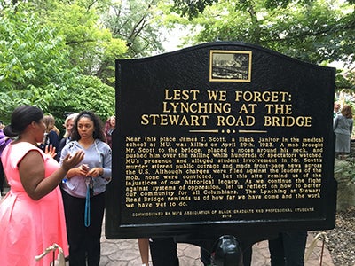 Members of the Association of Black Graduate and Professional Students solicited donations to have a marker placed in the plaza in memory of James Scott, a 35-year-old black man who was lynched in 1923 by a mob at the Stewart Road Bridge, in Columbia, MO. On September 30, 2016, over 100 people attended the unveiling of the plaque marking the site of the lynching. 