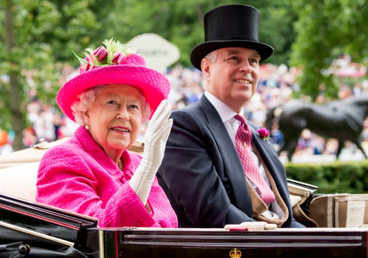 The queen waves to onlookers as she arrives at the Royal Ascot's Ladies Day.