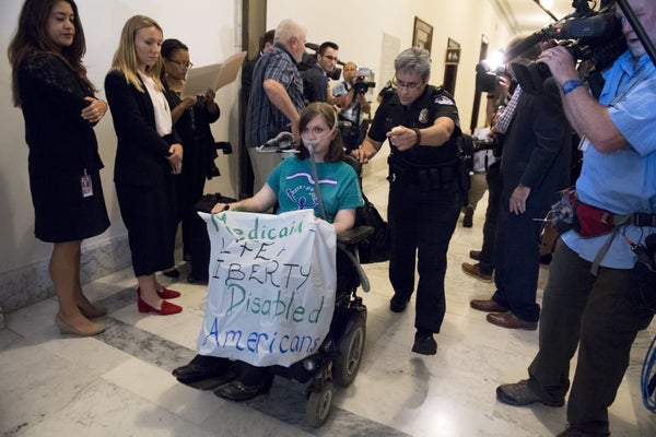 Image result for PHOTOS OF DISABLED PROTESTERS BEING CARRIED OUT OF US CAPITAL