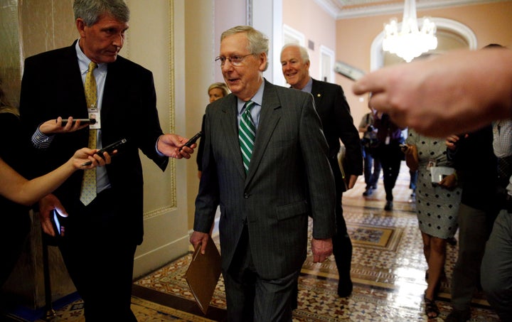 Senator Majority Leader Mitch McConnell is trailed by reporters as he walks to the Senate floor of the U.S. Capitol after unveiling a draft bill on health care in Washington on Thursday.