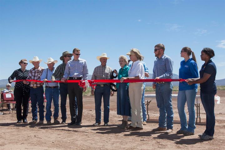 Ann English, chairwoman of the Cochise County Board of Supervisors, cuts the ribbon opening the Horseshoe Draw project for this year’s monsoon
