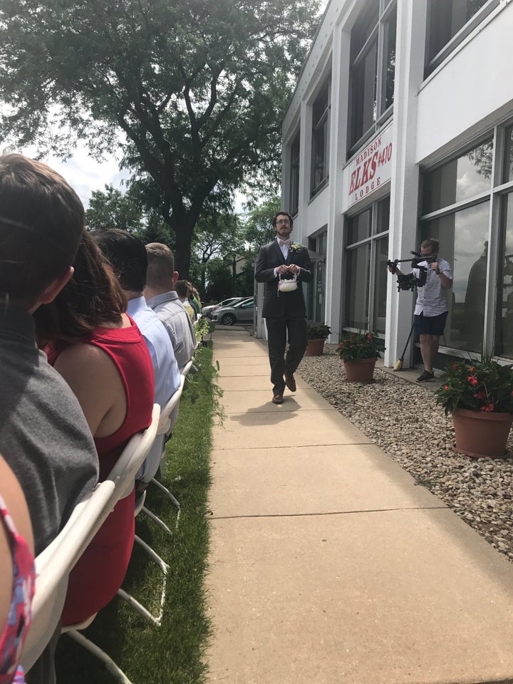 Casey begins his duties as flower man.