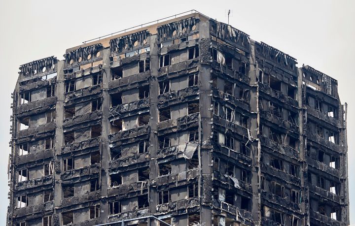 The charred remains of cladding pictured on the outer walls of the burnt out shell of the Grenfell Tower.