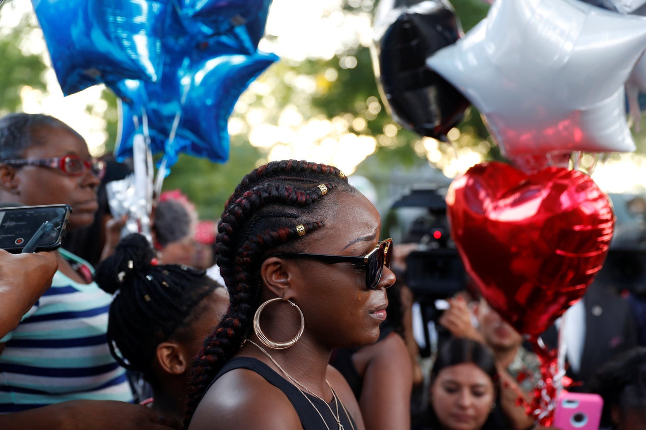 Kimberly Neal, sister of Sylville Smith, speaks at a vigil after disturbances following the police shooting of her brother. 