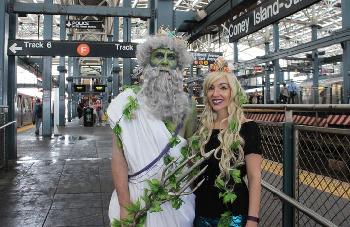 Two costumed participants exit the F Train to go watch the 2017 Coney Island Mermaid Parade