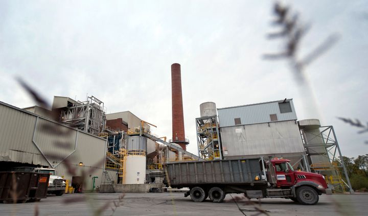 Trucks sit parked outside the municipal waste-to-energy incinerator facility in Harrisburg, Pennsylvania.