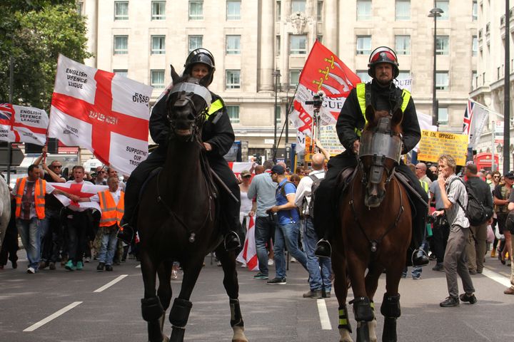 Police are clamping down on protests by the far-right and anti-fascist networks; an English Defence League protest in Park lane, London, from July 2016 is seen above