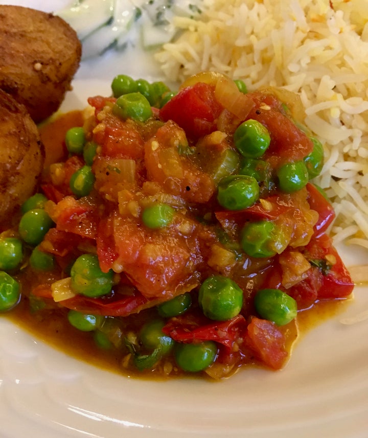 <p>Summer tomato and pea curry is reminiscent of mattar paneer, but without the cheese</p>