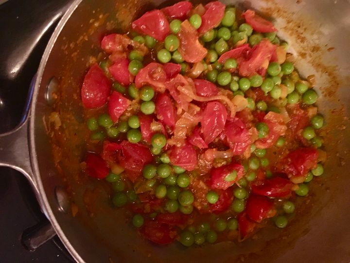 The peas simmer in the spiced tomato juices - add water if needed