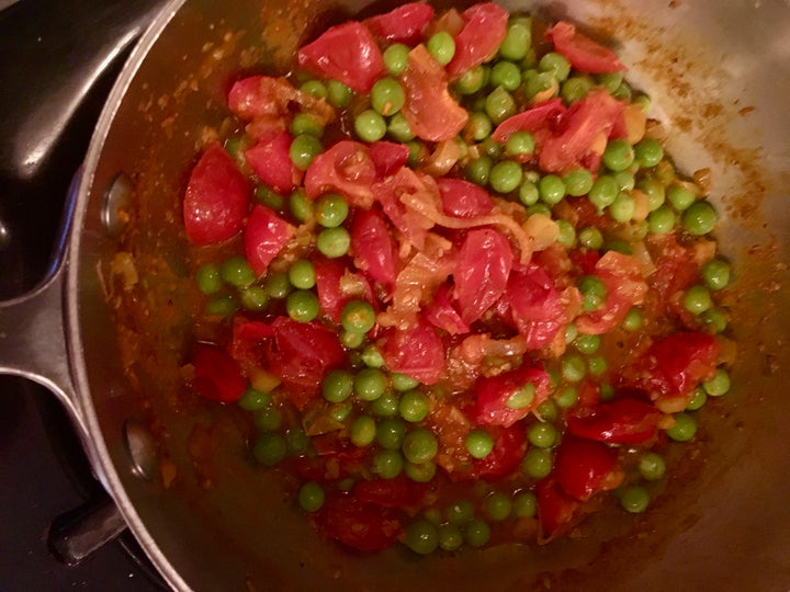 The peas simmer in the spiced tomato juices - add water if needed