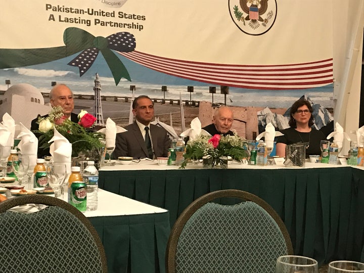 Ambassador Akbar Ahmed sits to the right of host Ambassador Chaudhry at the high table of the interfaith Iftar. To the Ambass