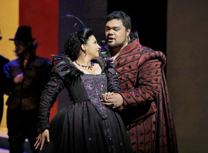 The Duke of Mantua (Pene Pati) seduces the Countess Ceprano (Amina Edris) in Act I of Rigoletto 