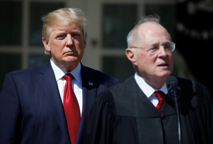 President Donald Trump listens as Justice Anthony Kennedy speaks during the swearing in ceremony for Judge Neil Gorsuch.