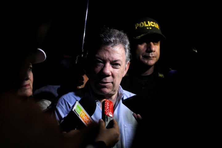 Colombian President Juan Manuel Santos at the scene near the Guatape reservoir.