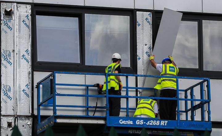 Potentially dangerous cladding is removed from an estate in Manchester.