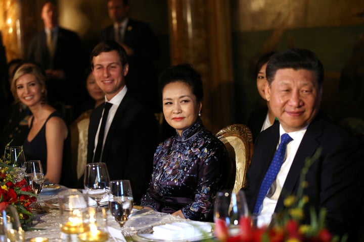 China's first lady Peng Liyuan looks at Chinese President Xi Jinping as she sits next to Trump advisers Jared Kushner and Ivanka Trump during a dinner at Trump's Mar-a-Lago estate in West Palm Beach, Florida, on April 6, 2017.