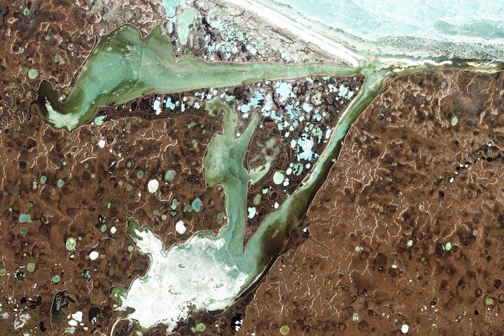 Scientists monitor landscapes like Omulyakhskaya and Khromskaya Bays in northern Siberia closely.