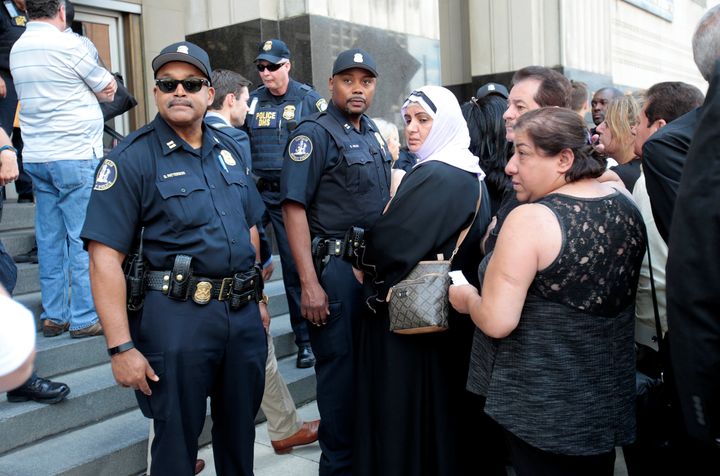 Family members of detainees line up to enter the federal court in Detroit. Late Monday, a federal judge halted the deportation of all Iraqi nationals detained during immigration sweeps across the U.S. this month.