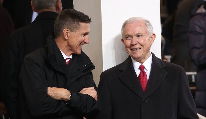 Attorney General nominee Sen. Jeff Sessions talks with National Security Advisor Michael Flynn inside of the inaugural parade reviewing stand in front of the White House on January 20, 2017.