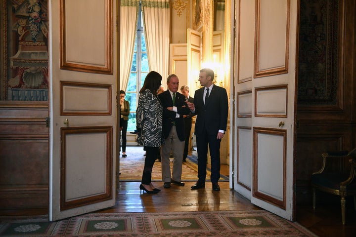 Climate crusaders: President Macron, right, with Paris Mayor Anne Hidalgo and former New York City mayor Michael Bloomberg a