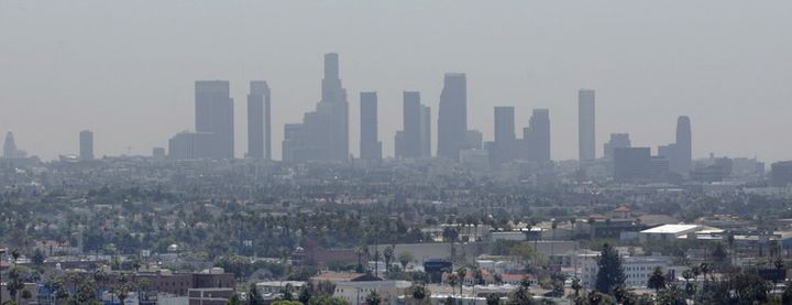 California’s strict car-emissions standards have markedly reduced air pollution in recent decades, but smog can still obscure the Los Angeles skyline. 