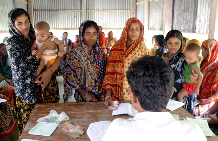 The first microloans were made to women in rural Bangladesh in the 1970s. Banesa Khatun (far left) here in 2006, was still u