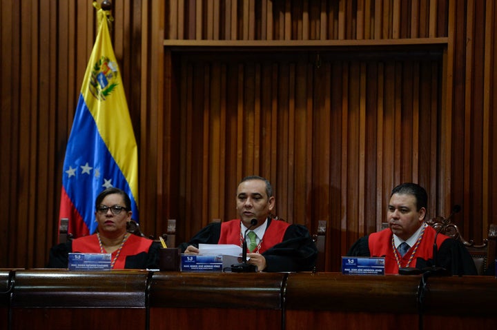 Venezuela's Supreme Court President Maikel Moreno (C) speaks during a press conference in Caracas. 