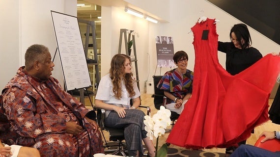 Saint Louis Fashion Incubator Designer Agnes Hamerlik showing her dress to André Leon Talley 