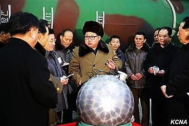 Kim Jong-un purporting to show a nuclear warhead capable of being fitted onto a missile.