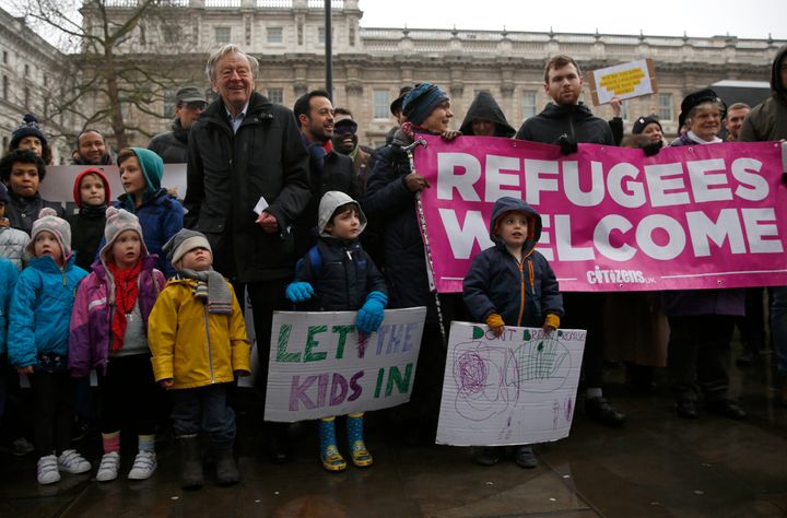 Alf Dubs with protestors before delivering a petition to Downing Street opposing the closure of the government scheme to bring unaccompanied child refugees to Britain from Europe.