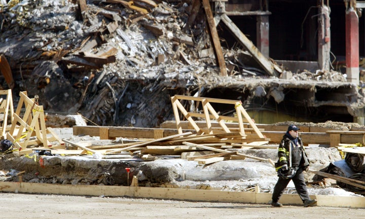 A firefighter walks past construction at ground zero, the site of the World Trade Center Sept. 11 terrorist attack.