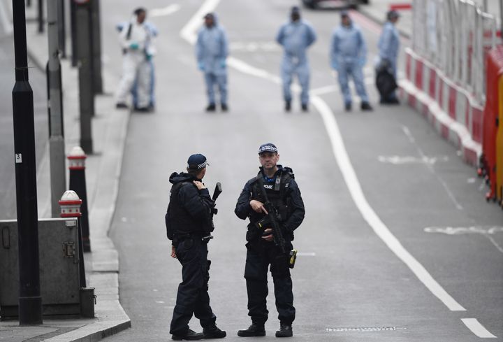  Armed police officers patrol London Bridge the day after the attack
