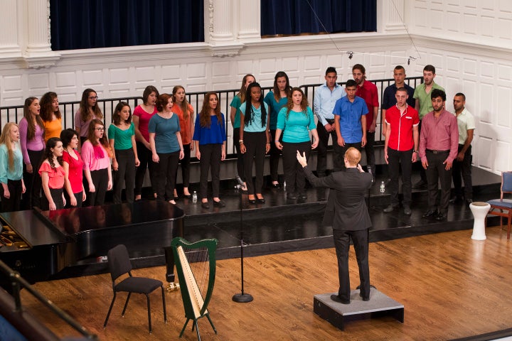 The Jerusalem Youth Chorus singing together, led by founder Micah Hendler.